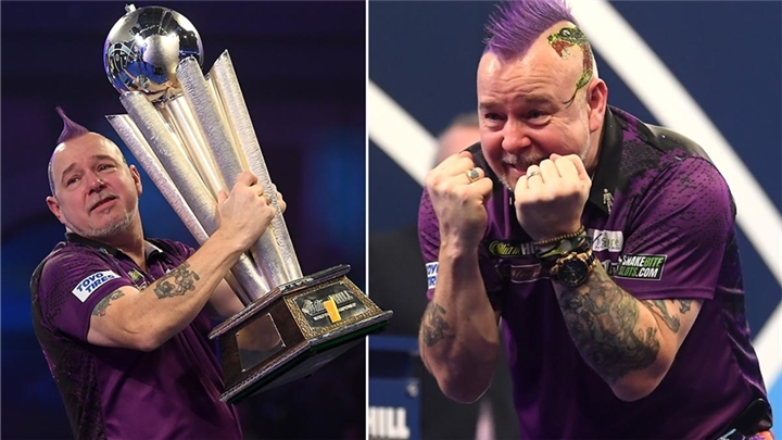 Peter Wright holds nerve to win second world title